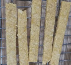 Savoury straws on a cooling rack.