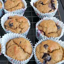 Spiced fruit muffins on a cooling rack