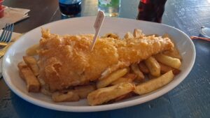 Gluten free fish and chips, with a stick to identify it as Gluten free.